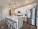 Stylish kitchen with a large island, stainless steel appliances, and ample counter space at 8660 Hudson Way, Brownsburg, IN 46112