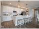 Well-lit kitchen with sleek white cabinetry, subway tile backsplash, and modern appliances at 8660 Hudson Way, Brownsburg, IN 46112