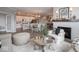 Inviting living area with hardwood floors, a cozy fireplace, and open access to the kitchen at 8660 Hudson Way, Brownsburg, IN 46112