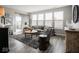 Inviting living room with large windows, plush seating, and stylish decor at 8660 Hudson Way, Brownsburg, IN 46112