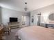 Spacious main bedroom with luxury chandelier and views of the ensuite bathroom at 8660 Hudson Way, Brownsburg, IN 46112
