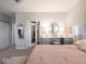 Elegant main bedroom with a sliding door leading to a walk-in closet and ensuite at 8660 Hudson Way, Brownsburg, IN 46112