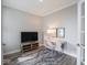 Cozy office space with neutral walls, stylish rug, and ample natural light at 8660 Hudson Way, Brownsburg, IN 46112