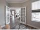 Bright office with modern french doors leading to the main living area at 8660 Hudson Way, Brownsburg, IN 46112