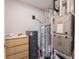 Utility room with modern water heater, and air conditioning unit at 8660 Hudson Way, Brownsburg, IN 46112