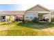Spacious backyard with well-kept lawn and covered patio perfect for outdoor entertaining at 8724 Faulkner Dr, Indianapolis, IN 46239