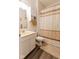 Cozy bathroom with a white vanity, toilet, and shower with neutral-toned curtain at 8724 Faulkner Dr, Indianapolis, IN 46239