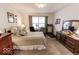 Serene bedroom showcasing carpet flooring, a window, and a comfortable layout at 8724 Faulkner Dr, Indianapolis, IN 46239