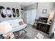 Bedroom with neutral paint, a comfortable chair, and a sun-filled window at 8724 Faulkner Dr, Indianapolis, IN 46239