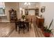 Charming dining area with natural light, wood floors, and decorative accents at 8724 Faulkner Dr, Indianapolis, IN 46239