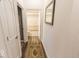 Hallway featuring hard wood flooring and view of the bathroom at 8724 Faulkner Dr, Indianapolis, IN 46239
