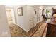 Hallway featuring hard wood flooring with access to the bathroom at 8724 Faulkner Dr, Indianapolis, IN 46239
