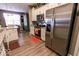 Bright kitchen featuring stainless steel appliances, wood floors, white cabinetry and modern countertops at 8724 Faulkner Dr, Indianapolis, IN 46239