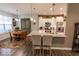 Modern kitchen with stainless steel appliances, granite countertops, and adjacent dining area at 8724 Faulkner Dr, Indianapolis, IN 46239