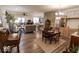 Inviting living room with wood flooring, a ceiling fan, and an open layout to kitchen area at 8724 Faulkner Dr, Indianapolis, IN 46239