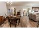 Comfortable living area with wood floors, traditional decor, and an abundance of natural light at 8724 Faulkner Dr, Indianapolis, IN 46239