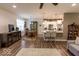 Inviting living space with open floor plan, lots of natural light, and wood-look flooring at 8724 Faulkner Dr, Indianapolis, IN 46239