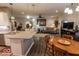 View of the open floor plan showcasing the kitchen island, dining area, and living room at 8724 Faulkner Dr, Indianapolis, IN 46239