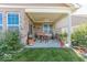 Covered back patio area featuring comfortable seating, ceiling fan, and serene backyard views, great for relaxation at 8724 Faulkner Dr, Indianapolis, IN 46239