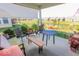 Inviting patio with comfortable seating and scenic views of the well-maintained backyard at 8724 Faulkner Dr, Indianapolis, IN 46239