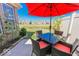 Private backyard patio with outdoor dining set and community pond views, perfect for entertaining at 8724 Faulkner Dr, Indianapolis, IN 46239
