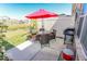 Private backyard patio featuring outdoor dining set, grill, and view of community pond at 8724 Faulkner Dr, Indianapolis, IN 46239