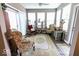 Relaxing sunroom featuring neutral walls, ample seating, and sliding glass doors for indoor-outdoor living at 8724 Faulkner Dr, Indianapolis, IN 46239