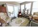 Bright sunroom featuring neutral walls, ample seating, and sliding glass doors for indoor-outdoor living at 8724 Faulkner Dr, Indianapolis, IN 46239