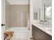 Cozy bathroom with a soaking tub, vanity, and subway tile surround at 877 N East St # 103, Indianapolis, IN 46202