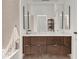Bathroom featuring a double vanity with a marble countertop and modern fixtures at 877 N East St # 103, Indianapolis, IN 46202