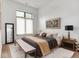 Relaxing bedroom with a cozy rug and a large window with lots of natural light at 877 N East St # 103, Indianapolis, IN 46202