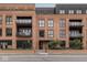 Modern brick apartment building featuring balconies and large windows for ample natural light at 877 N East St # 103, Indianapolis, IN 46202