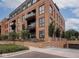 Beautiful brick condominium with lush landscaping and a private garage entrance at 877 N East St # 103, Indianapolis, IN 46202
