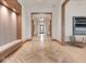 Inviting hallway featuring herringbone floors, paneled walls and accent seating at 877 N East St # 103, Indianapolis, IN 46202