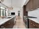Modern kitchen with stainless steel appliances, white countertops and hardwood floors at 877 N East St # 103, Indianapolis, IN 46202