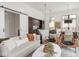 Modern living room with open floor plan leading to kitchen and dining area at 877 N East St # 103, Indianapolis, IN 46202