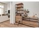 View of the living room showing the open floor plan and custom shelving area at 877 N East St # 103, Indianapolis, IN 46202