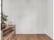 A modern living room features hardwood floors and a custom shelf adding a touch of sophistication at 877 N East St # 103, Indianapolis, IN 46202