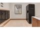 Lobby area with mailboxes, a Luxer One package locker, and modern decor at 877 N East St # 103, Indianapolis, IN 46202