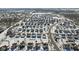 Expansive aerial shot of a community with snow-dusted rooftops in a suburban setting at 10404 Kings Gap Way, Indianapolis, IN 46234