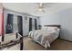 Comfortable bedroom with ceiling fan, windows, and ample space for a crib or other furnishings at 10404 Kings Gap Way, Indianapolis, IN 46234