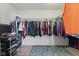 Walk-in closet with custom shelving, ample hanging space and blue rug at 10404 Kings Gap Way, Indianapolis, IN 46234