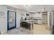 Eat-in kitchen featuring granite countertops, breakfast bar, stainless steel appliances, and ample cabinet space at 10404 Kings Gap Way, Indianapolis, IN 46234