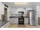 Efficient kitchen with stainless steel appliances, granite countertops, and ample storage space at 10404 Kings Gap Way, Indianapolis, IN 46234