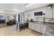 Well-lit kitchen with bar stool seating area, granite countertops, and easy access to the living room at 10404 Kings Gap Way, Indianapolis, IN 46234