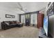 Inviting living room area featuring a comfortable couch, large windows, and modern décor at 10404 Kings Gap Way, Indianapolis, IN 46234