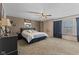 Spacious main bedroom featuring a ceiling fan, carpet and large windows for natural light at 10404 Kings Gap Way, Indianapolis, IN 46234