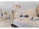 Large main bedroom featuring carpet, ceiling fan, and ensuite bathroom at 10404 Kings Gap Way, Indianapolis, IN 46234