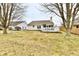 A well-maintained backyard featuring a deck, screened porch, and ample green space at 10669 Springston Ct, Fishers, IN 46037