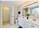 Bathroom features double vanity with a walk-in closet in the background at 10669 Springston Ct, Fishers, IN 46037
